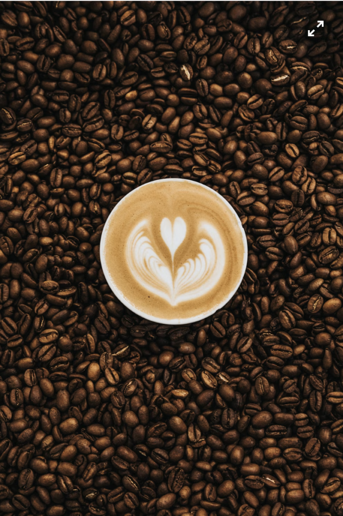 Light vs dark roast beans compared, cup of coffee with latte art