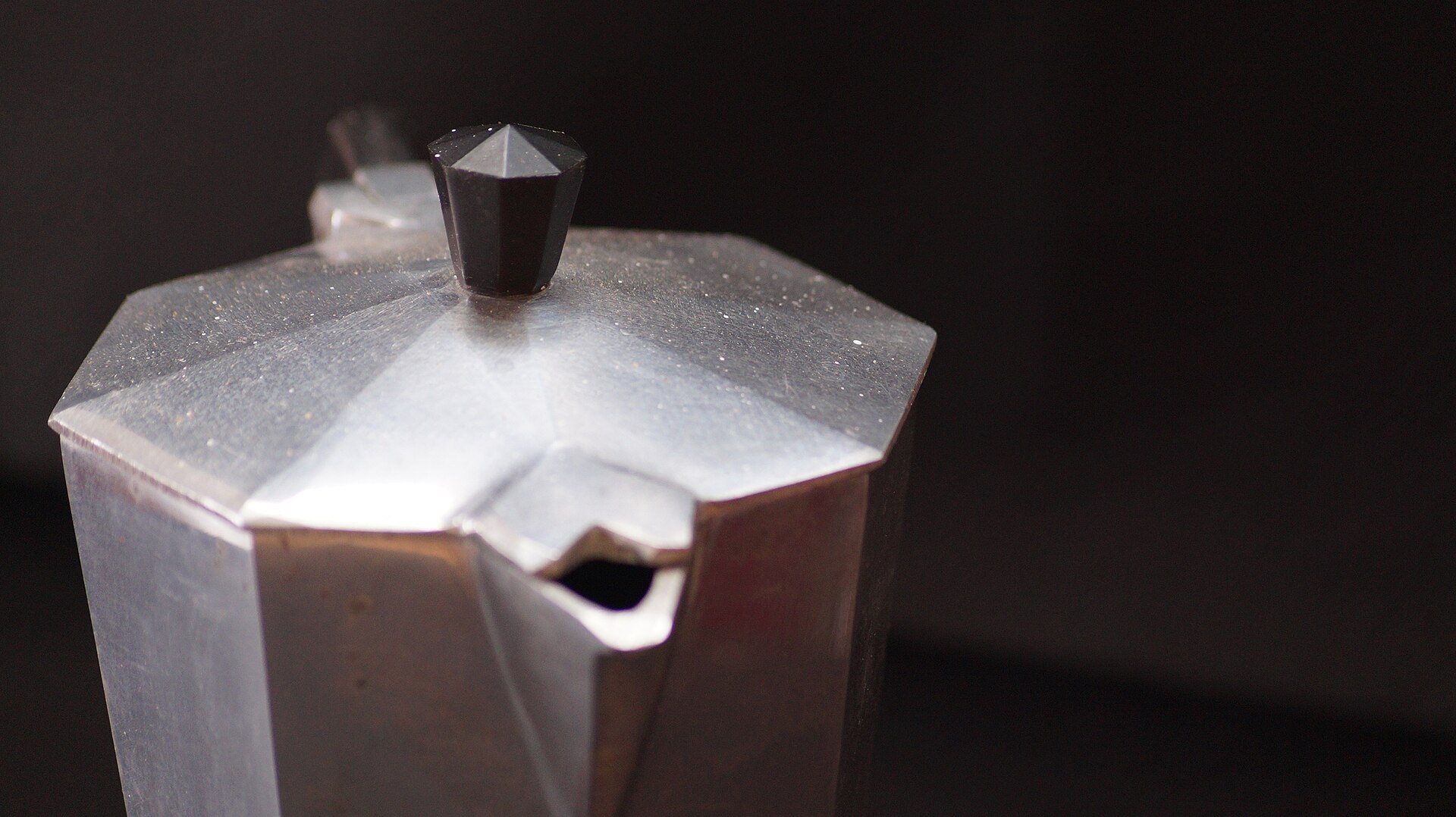 Close-up of a moka pot on a table, ready to be cleaned