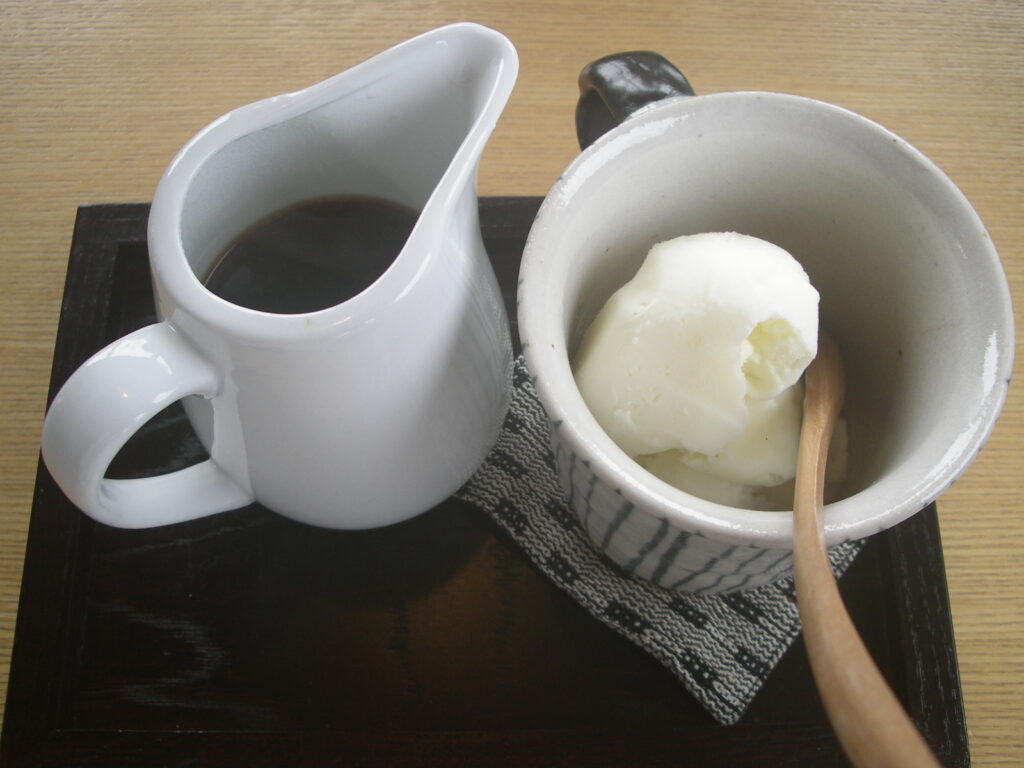 Affogato served the classic way, with espresso in a small jug beside a cup of gelato