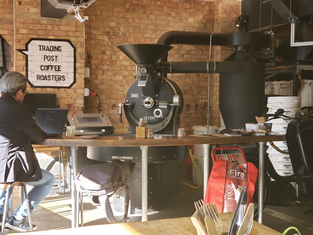 A traditional drum coffee roaster in an independent roastery, where beans start coffee degassing