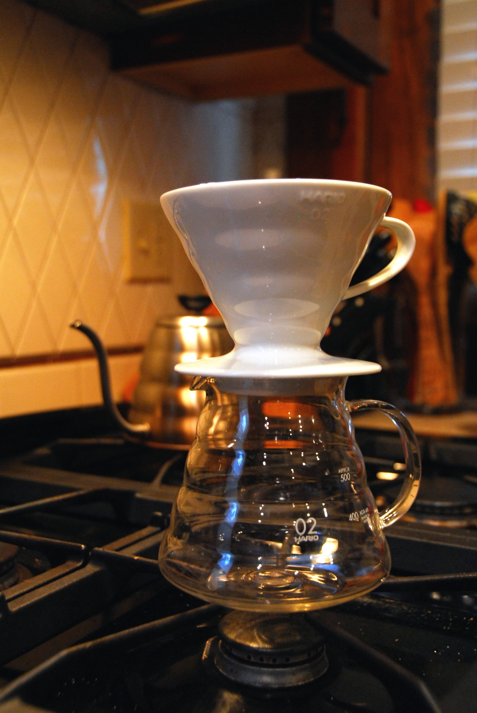 Hario V60 dripper and a gooseneck kettle ready for pour-over