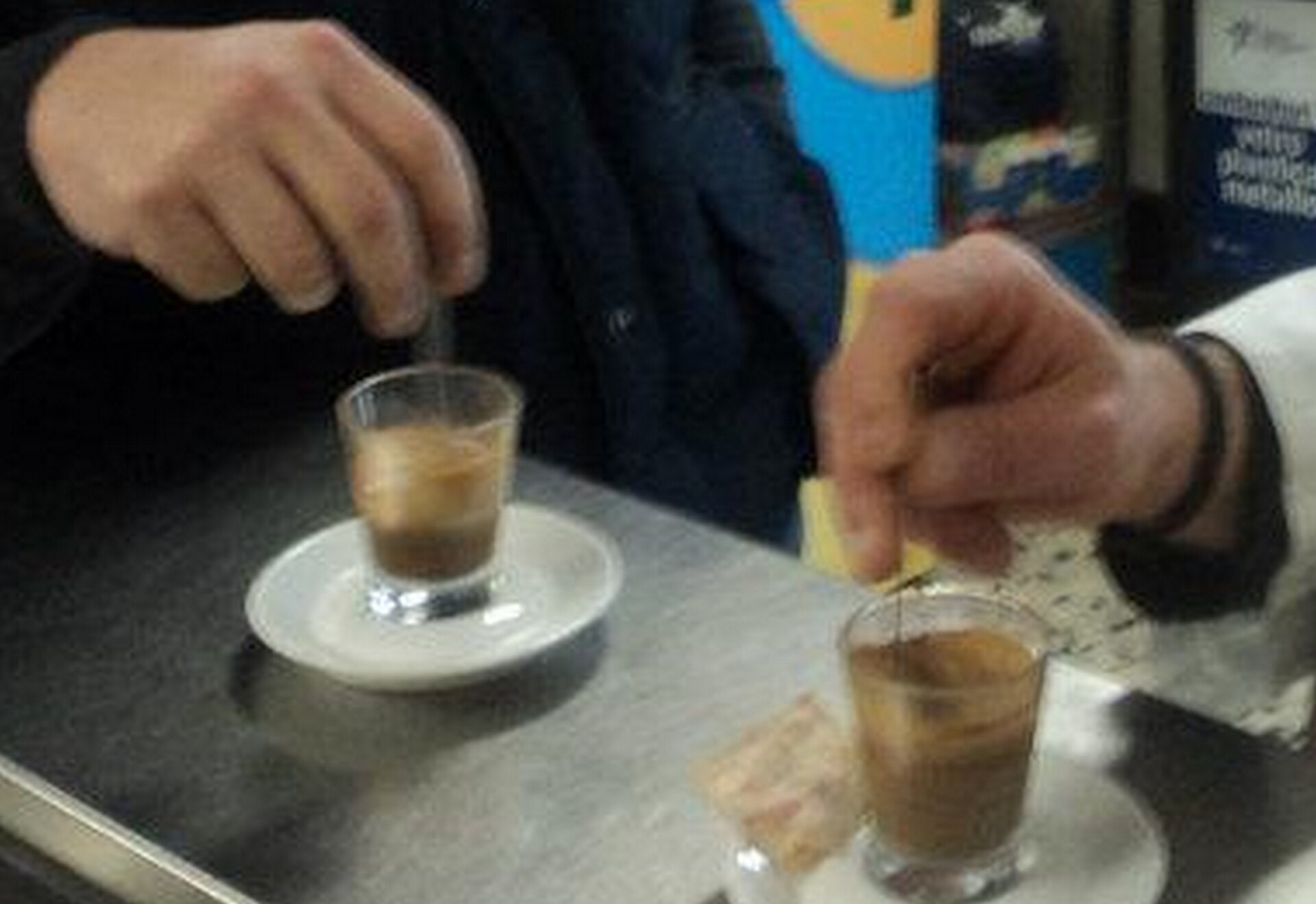 Customers at a street-side Italian coffee bar in Rome