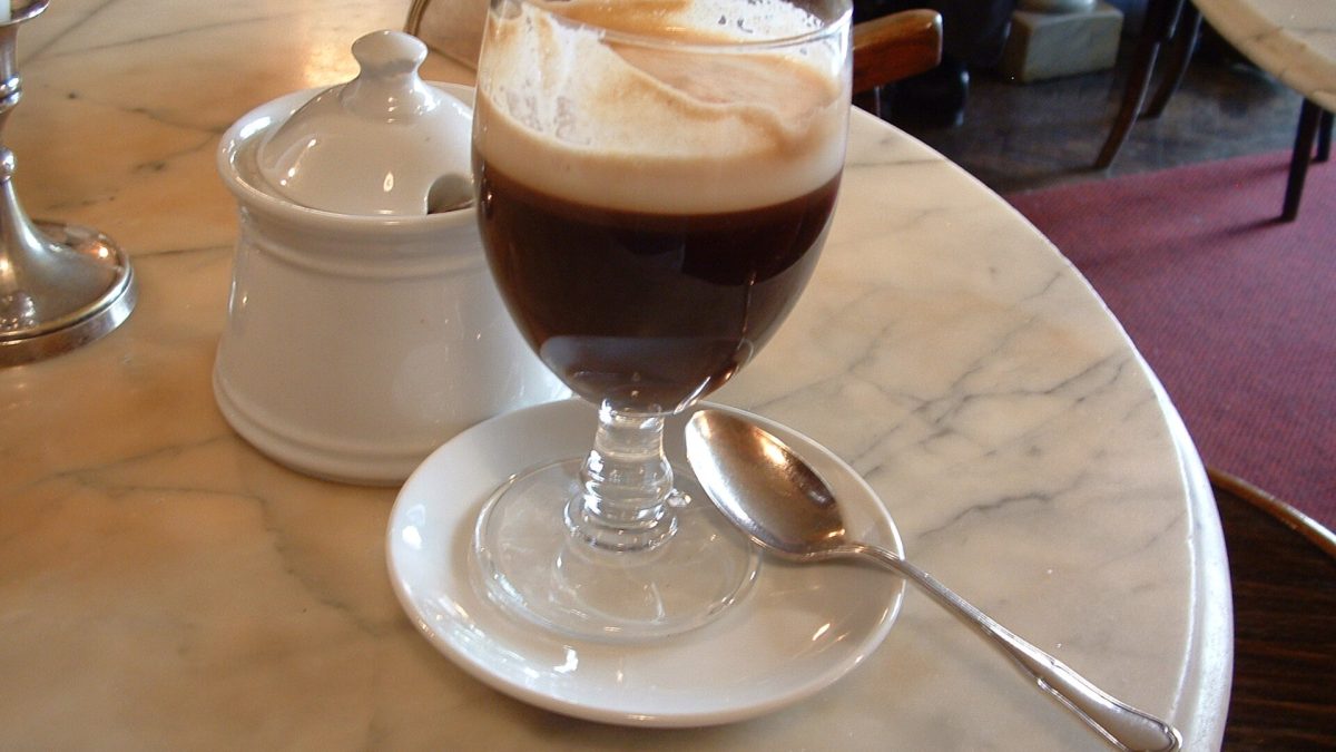 A glass of bicerin, the layered Turin drink of espresso, chocolate and cream