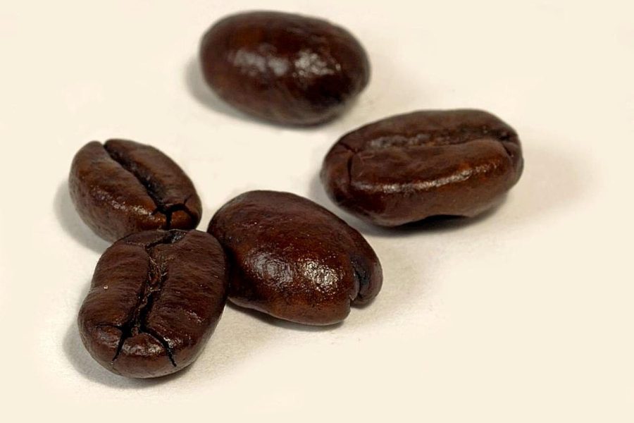 Dark roasted coffee beans, a common sign of strong coffee taste