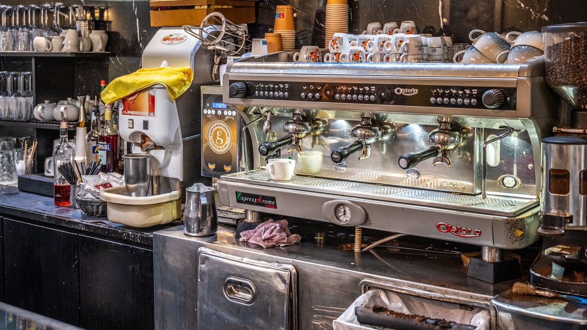 Espresso machine on the counter of a coffee bar in Rome, where Italian coffee drinks are ordered