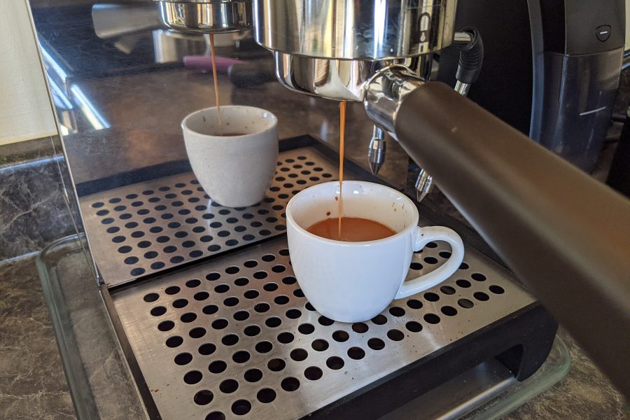 Espresso pouring from a naked portafilter during a dialed-in shot