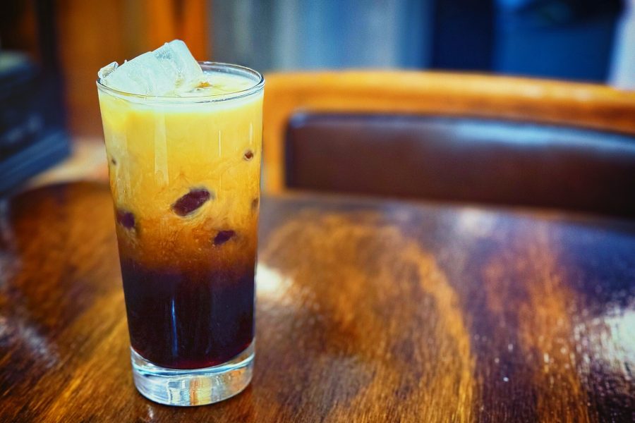Japanese iced coffee with milk in a tall glass over ice
